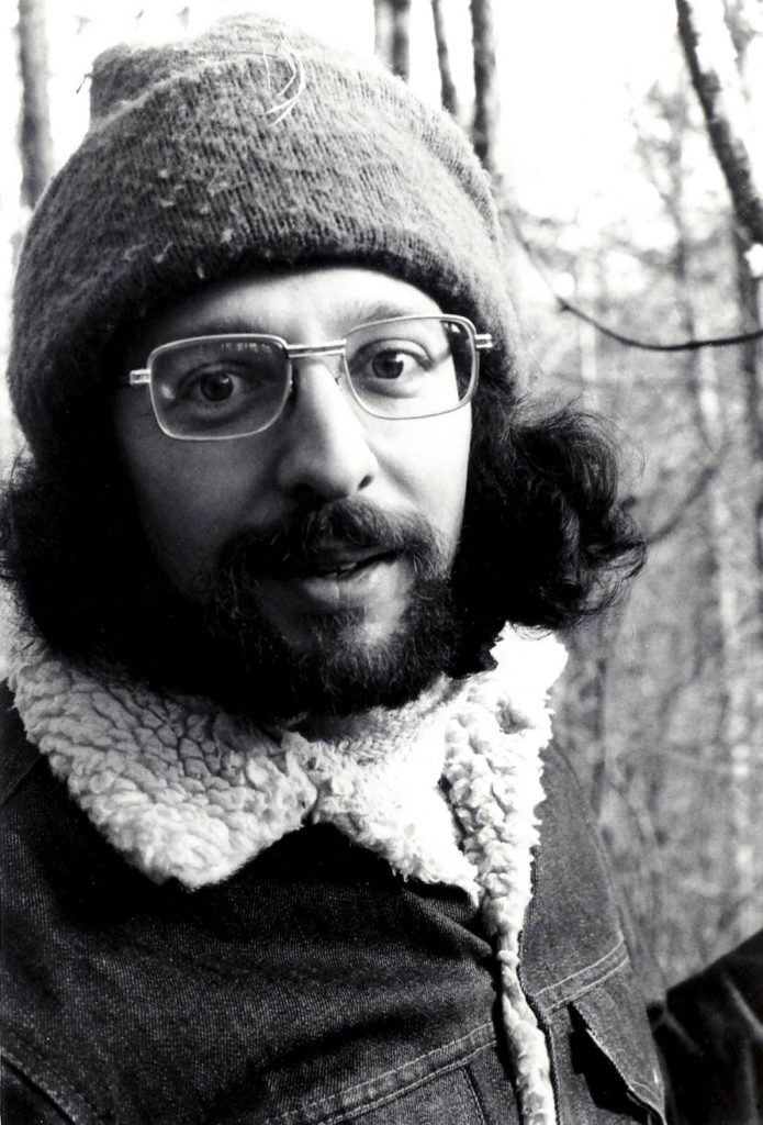 Steven Forrest outdoors in a knit cap and glasses in the mid-1970s